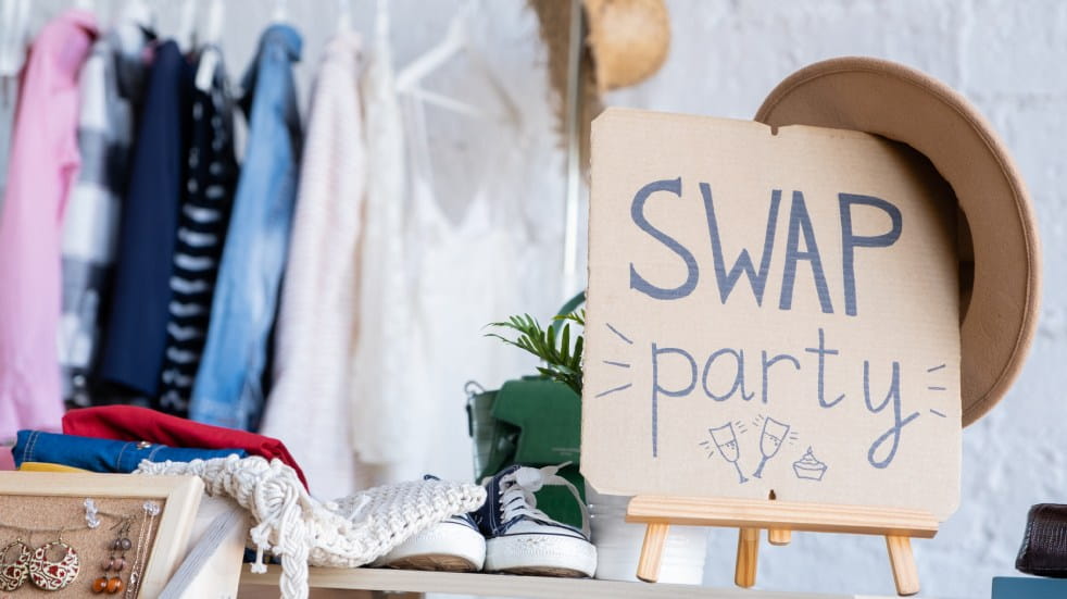 Swap party sign and clothes rail